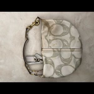 White and silver Coach logo bag